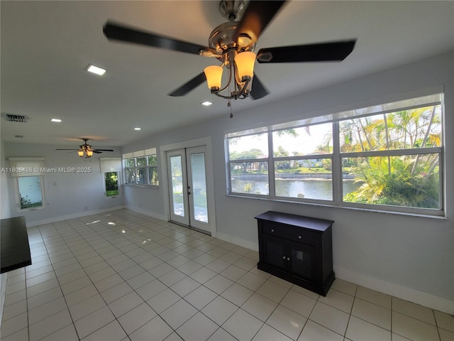 4519 NW 49th Dr, Tamarac, FL 33319 - spare room with a ceiling fan, light tile patterned floors, french doors, recessed lighting, and baseboards