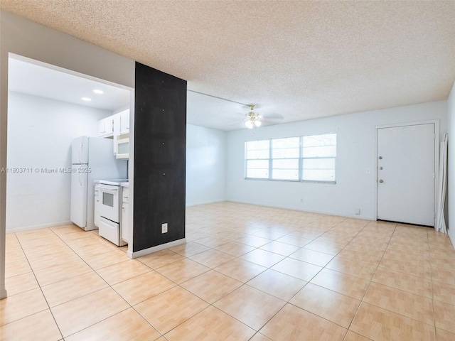 13250 SW 7th Ct Unit 208L, Pembroke Pines, FL 33027 - kitchen with white appliances, light tile patterned floors, white cabinets, ceiling fan, and a textured ceiling