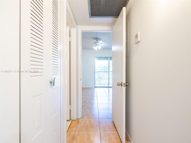13250 SW 7th Ct Unit 208L, Pembroke Pines, FL 33027 - hall featuring light tile patterned floors and baseboards