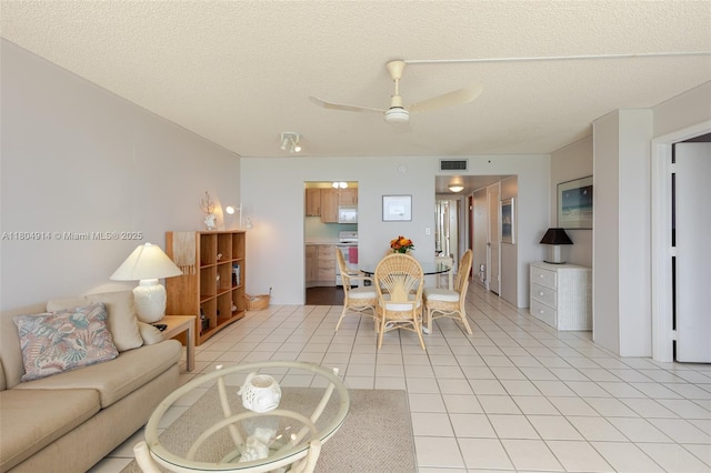 2000 Coco Plum Dr Unit 301, Marathon, FL 33050 - living area with ceiling fan and a textured ceiling