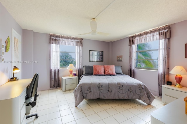 2000 Coco Plum Dr Unit 301, Marathon, FL 33050 - bedroom with ceiling fan, light tile patterned floors, and a textured ceiling
