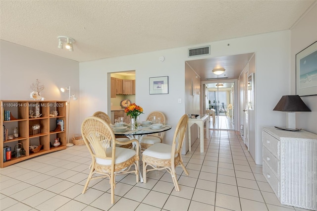 2000 Coco Plum Dr Unit 301, Marathon, FL 33050 - dining area with a textured ceiling and light tile patterned floors