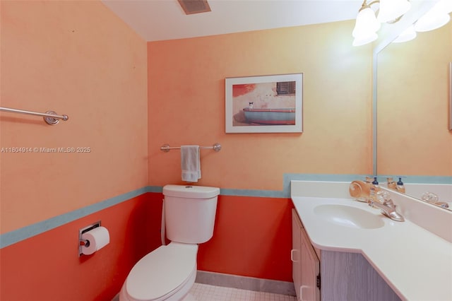 2000 Coco Plum Dr Unit 301, Marathon, FL 33050 - half bathroom featuring toilet, vanity, and tile patterned flooring