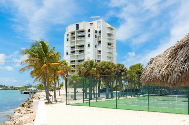 2000 Coco Plum Dr Unit 301, Marathon, FL 33050 - view of community with a tennis court, fence, and a water view