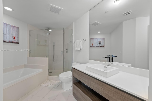 1100 S Miami Ave Unit 3210, Miami, FL 33130 - bathroom with toilet, a shower stall, tile patterned floors, a garden tub, and vanity