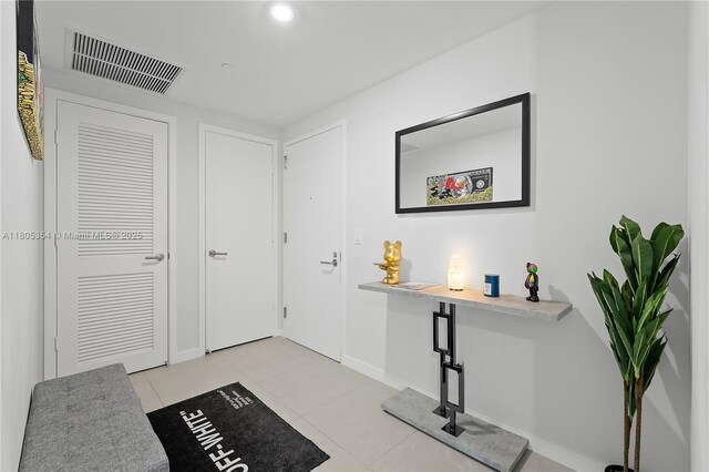 1100 S Miami Ave Unit 3210, Miami, FL 33130 - foyer entrance with light tile patterned floors and recessed lighting