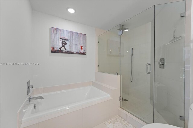 1100 S Miami Ave Unit 3210, Miami, FL 33130 - bathroom featuring a garden tub, a stall shower, and recessed lighting