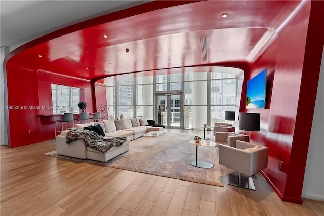 1100 S Miami Ave Unit 3210, Miami, FL 33130 - living area featuring wood finished floors, arched walkways, and french doors