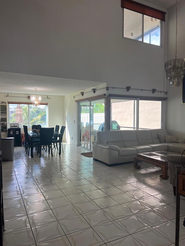 897 NW 97th Ave, Plantation, FL 33324 - living room featuring a chandelier, healthy amount of natural light, and light tile patterned floors