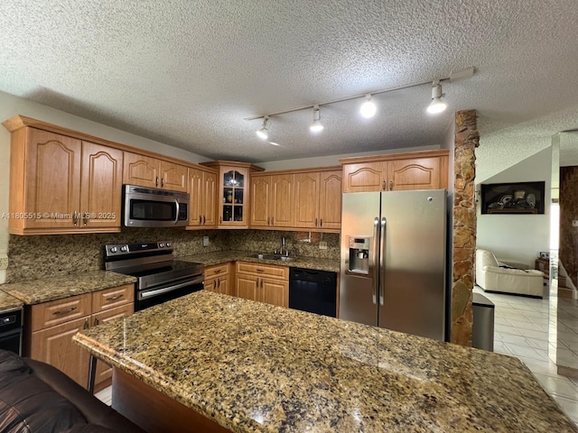 897 NW 97th Ave, Plantation, FL 33324 - kitchen with stainless steel appliances, glass insert cabinets, decorative backsplash, light tile patterned floors, and a kitchen breakfast bar