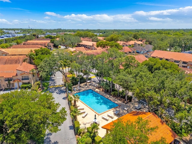 aerial perspective of suburban area featuring a pool