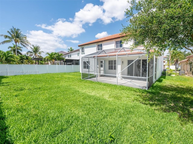 1128 Hidden Valley Way, Weston, FL 33327 - back of house featuring a patio area, glass enclosure, central AC, and stucco siding