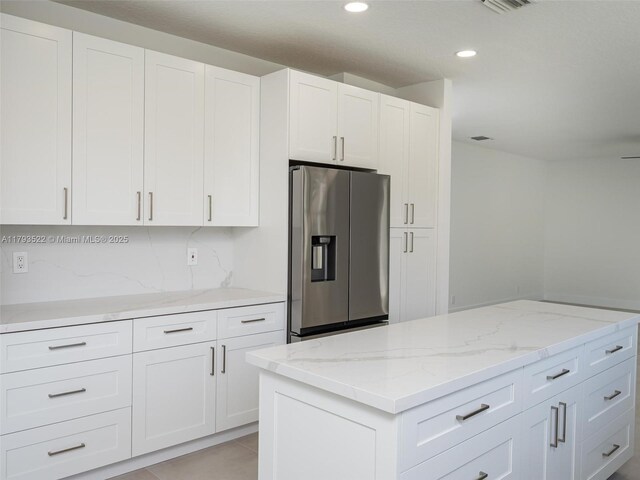 1128 Hidden Valley Way, Weston, FL 33327 - kitchen featuring stainless steel fridge with ice dispenser, white cabinets, and recessed lighting