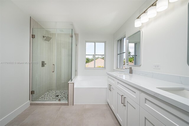 1128 Hidden Valley Way, Weston, FL 33327 - bathroom with a bath, a shower stall, double vanity, tile patterned flooring, and baseboards
