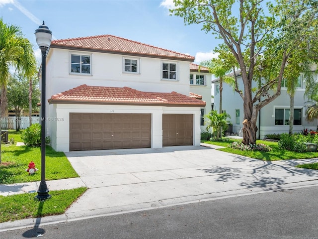 1128 Hidden Valley Way, Weston, FL 33327 - mediterranean / spanish house featuring stucco siding, concrete driveway, a tile roof, and an attached garage