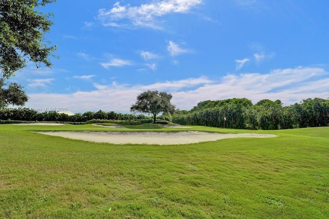 1510 Whitehall Dr Unit 402, Davie, FL 33324 - view of community featuring view of golf course, a yard, and view of wooded area
