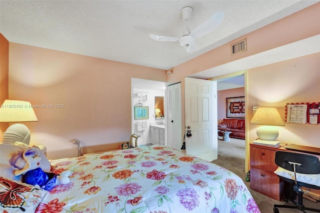 1510 Whitehall Dr Unit 402, Davie, FL 33324 - carpeted bedroom featuring a closet, ensuite bath, and ceiling fan