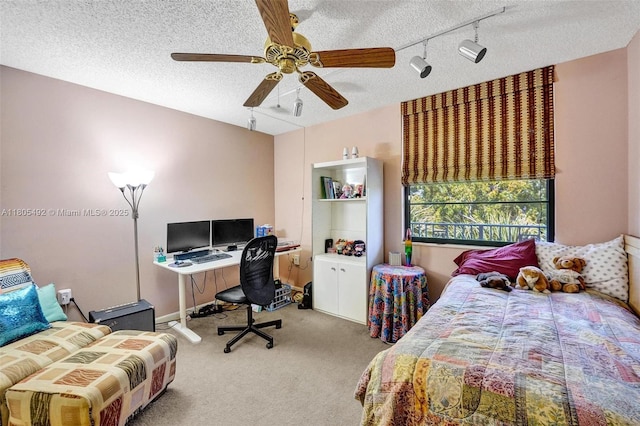 1510 Whitehall Dr Unit 402, Davie, FL 33324 - carpeted bedroom with a textured ceiling, ceiling fan, and rail lighting
