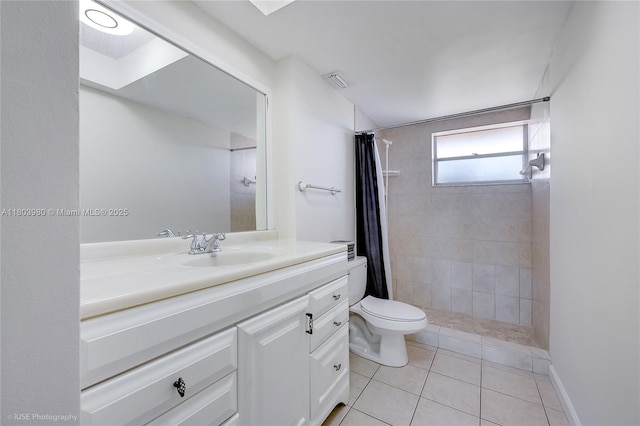 1551 NE Miami Gardens Dr Unit 322, Miami, FL 33179 - bathroom featuring vanity, a tile shower, tile patterned flooring, and a skylight
