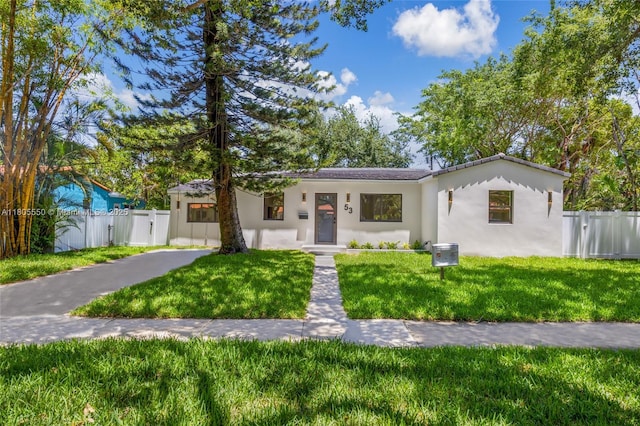53 NW 107th St, Miami Shores, FL 33168 - view of front of property with stucco siding and a gate