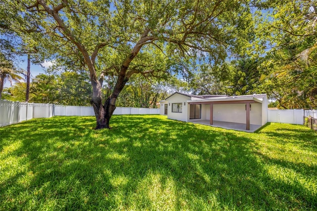 53 NW 107th St, Miami Shores, FL 33168 - fenced backyard with a patio area