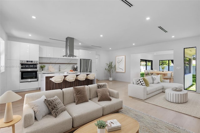 53 NW 107th St, Miami Shores, FL 33168 - living area with recessed lighting and light wood finished floors