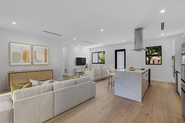 53 NW 107th St, Miami Shores, FL 33168 - living room featuring light wood finished floors and recessed lighting