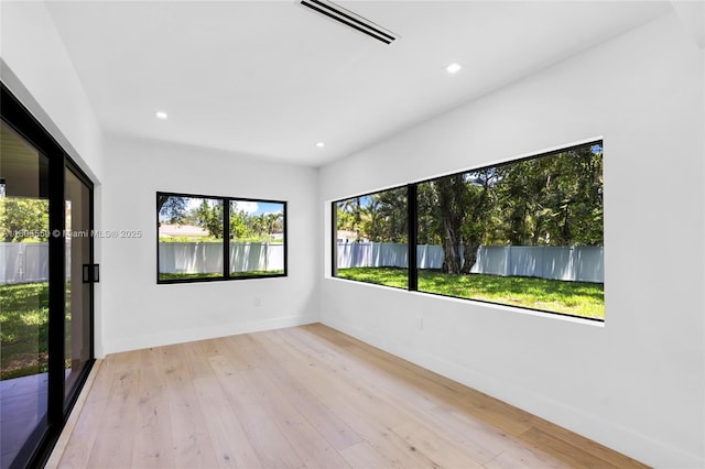 53 NW 107th St, Miami Shores, FL 33168 - spare room with wood-type flooring and recessed lighting