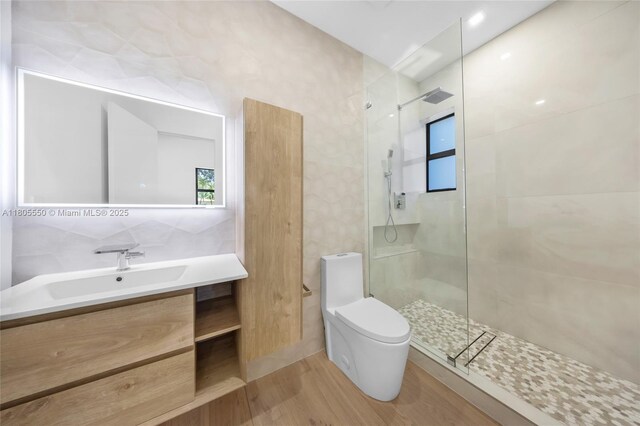 53 NW 107th St, Miami Shores, FL 33168 - bathroom with walk in shower, wood finished floors, and vanity