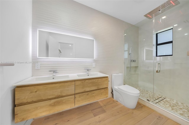 53 NW 107th St, Miami Shores, FL 33168 - bathroom with wood finished floors, a shower stall, and double vanity