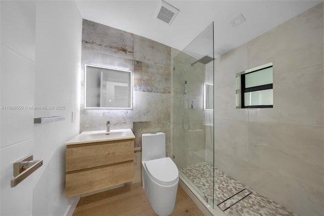 53 NW 107th St, Miami Shores, FL 33168 - bathroom with tile walls, a walk in shower, vanity, and wood finished floors