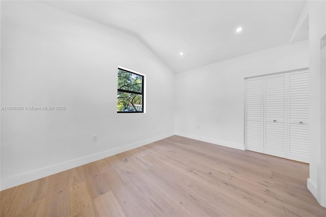 53 NW 107th St, Miami Shores, FL 33168 - unfurnished bedroom featuring lofted ceiling, a closet, recessed lighting, and light wood-style floors