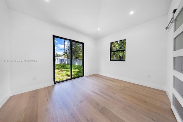 53 NW 107th St, Miami Shores, FL 33168 - unfurnished room featuring plenty of natural light, light wood-style floors, and recessed lighting