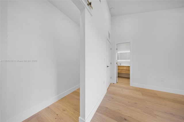53 NW 107th St, Miami Shores, FL 33168 - corridor with light wood finished floors and baseboards