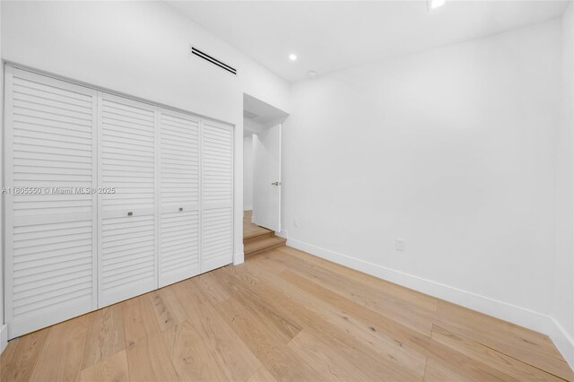 53 NW 107th St, Miami Shores, FL 33168 - unfurnished bedroom with wood finished floors, a closet, and recessed lighting