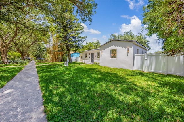 53 NW 107th St, Miami Shores, FL 33168 - rear view of property with stucco siding