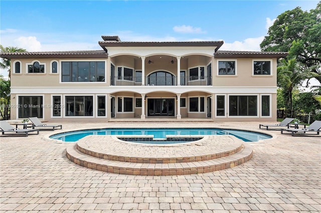 11930 NW 8th St, Plantation, FL 33325 - rear view of house featuring a balcony, a patio, stucco siding, and a tile roof