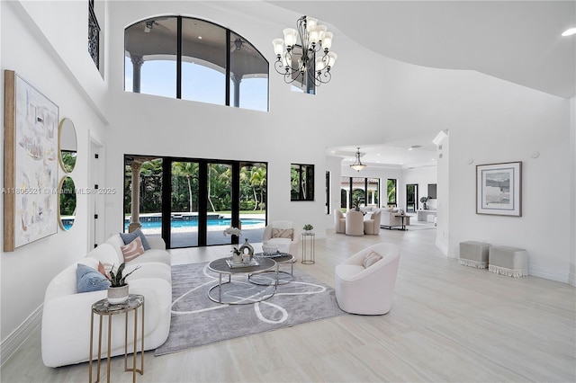 11930 NW 8th St, Plantation, FL 33325 - living area with a towering ceiling, french doors, baseboards, and a chandelier