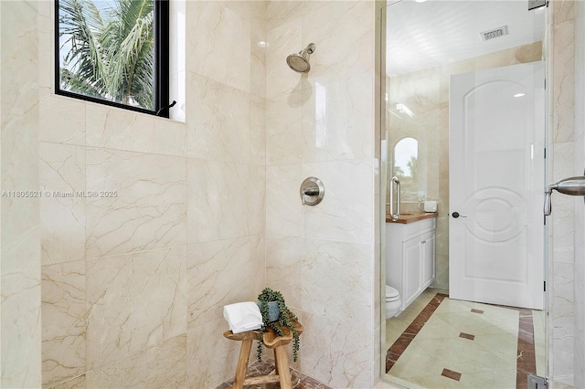 11930 NW 8th St, Plantation, FL 33325 - bathroom with inlaid floor details, a tile shower, vanity, and toilet