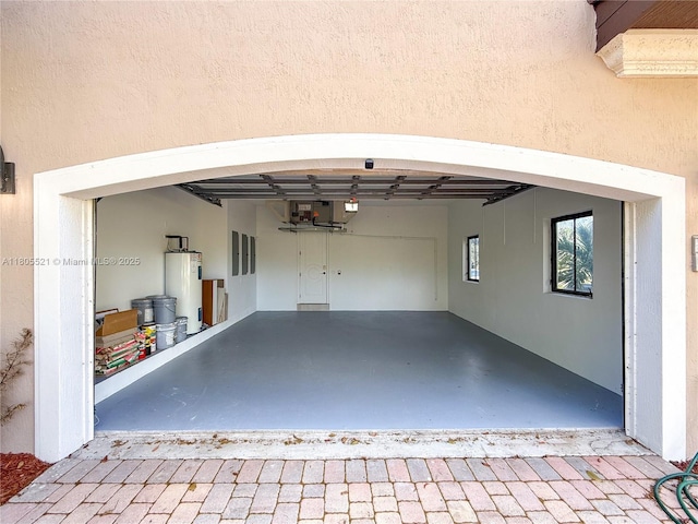 11930 NW 8th St, Plantation, FL 33325 - garage featuring water heater and decorative driveway