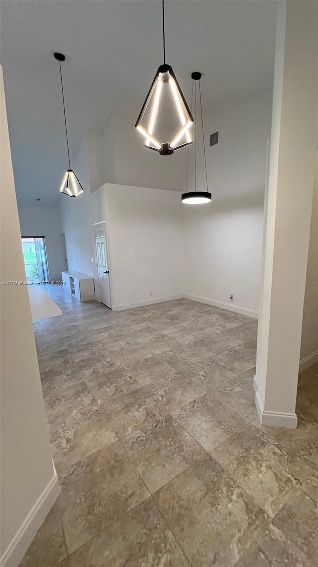 2615 Spiceberry Ln Unit 2625, Boynton Beach, FL 33436 - unfurnished dining area featuring baseboards and high vaulted ceiling
