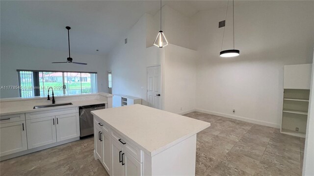 2615 Spiceberry Ln Unit 2625, Boynton Beach, FL 33436 - kitchen featuring stainless steel dishwasher, high vaulted ceiling, open floor plan, white cabinets, and pendant lighting