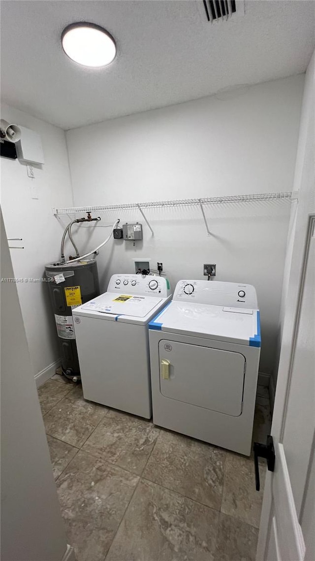 2615 Spiceberry Ln Unit 2625, Boynton Beach, FL 33436 - washroom with water heater and independent washer and dryer