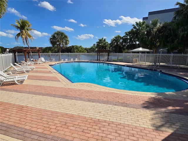 9375 Fontainebleau Blvd Unit L433, Miami, FL 33172 - community pool with a pergola, fence, and a patio