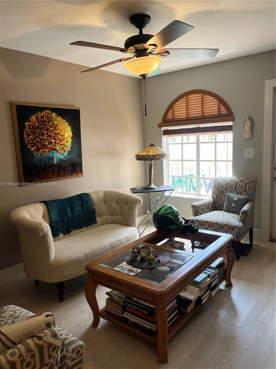 3901 SW 153rd Ct, Miami, FL 33185 - living room featuring wood finished floors and a ceiling fan