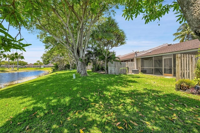 1054 NW 53rd St, Deerfield Beach, FL 33064 - view of yard featuring a water view, a sunroom, and central air condition unit