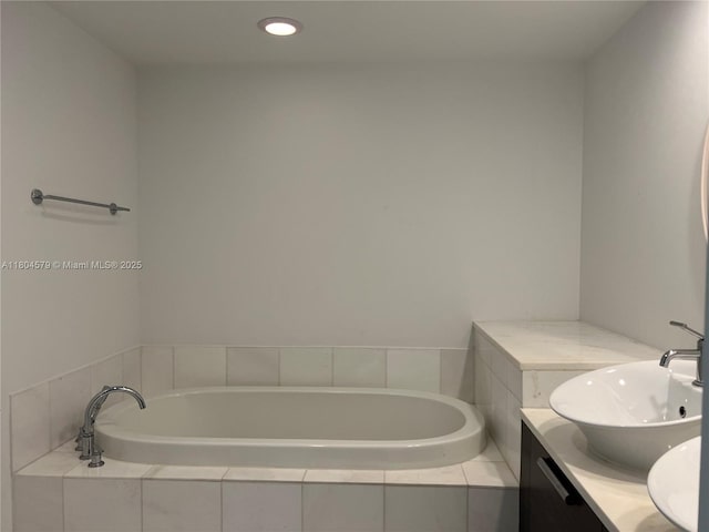 2950 NE 188th St Unit 444, Aventura, FL 33180 - bathroom with a garden tub, vanity, and recessed lighting