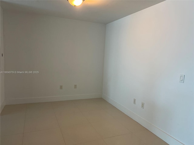 2950 NE 188th St Unit 444, Aventura, FL 33180 - empty room featuring baseboards and light tile patterned floors
