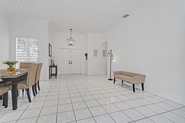 16401 SW 94th St, Miami, FL 33196 - foyer entrance featuring crown molding, baseboards, and a chandelier
