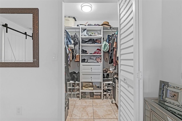 16401 SW 94th St, Miami, FL 33196 - spacious closet featuring a barn door and light tile patterned floors